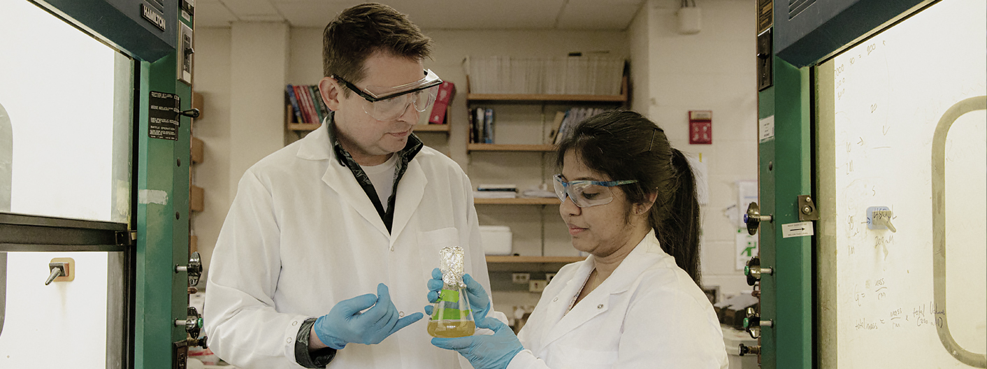 Jared Anderson and a graduate student in a chemistry lab